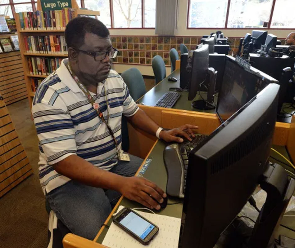 Etienne Douglas manages the Webstars program at the Marin City Library, teaching high school students how to use a variety of computer programs. Robert Tong — Marin Independent Journal